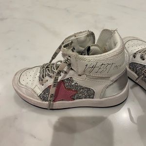 Little girl, high top shoes. Size one